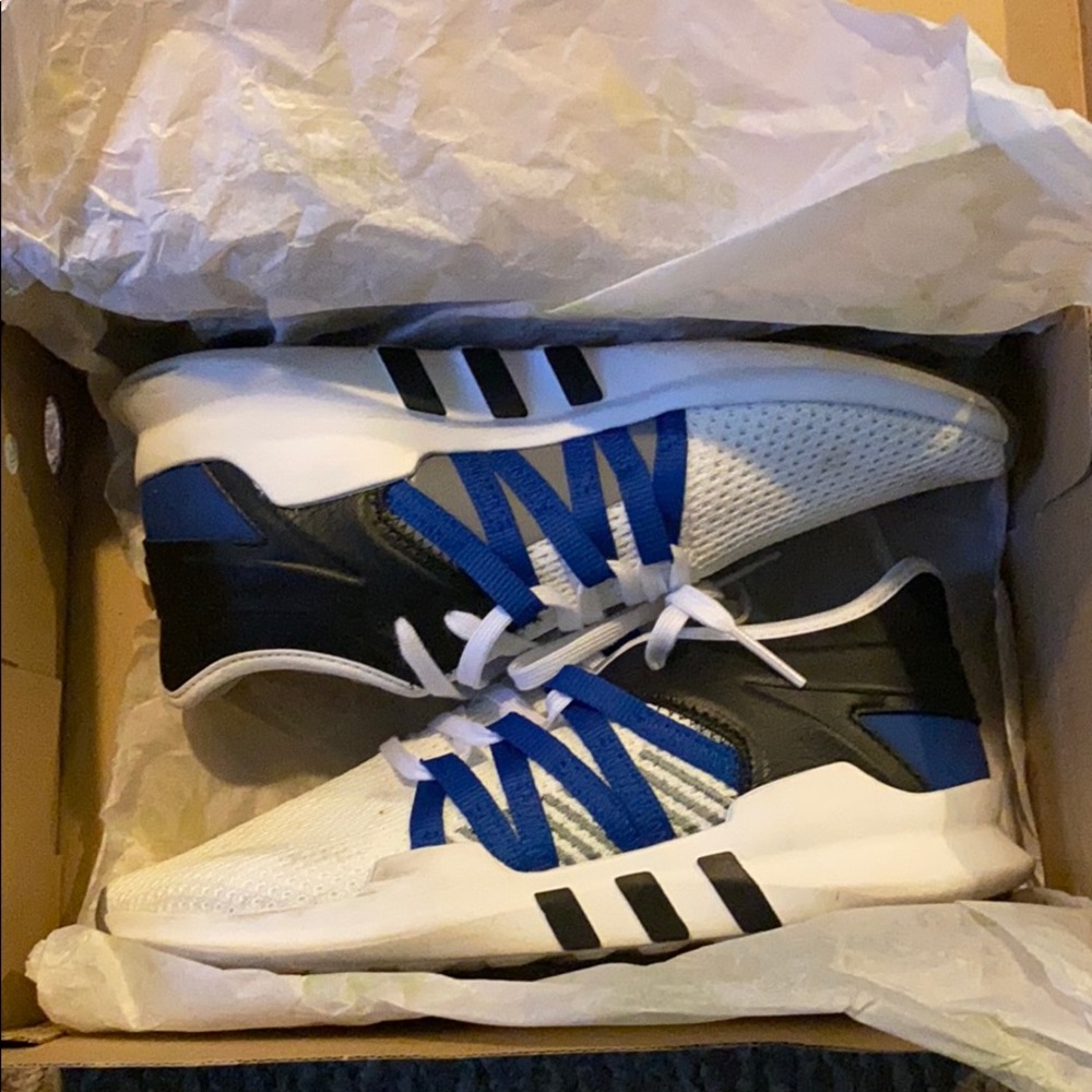 White,black, and blue adidas